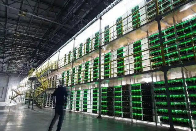 A miner working on a mining rig, highlighting the technical aspect of the industry.